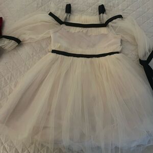 Elegant Cream Dress with Black Accents